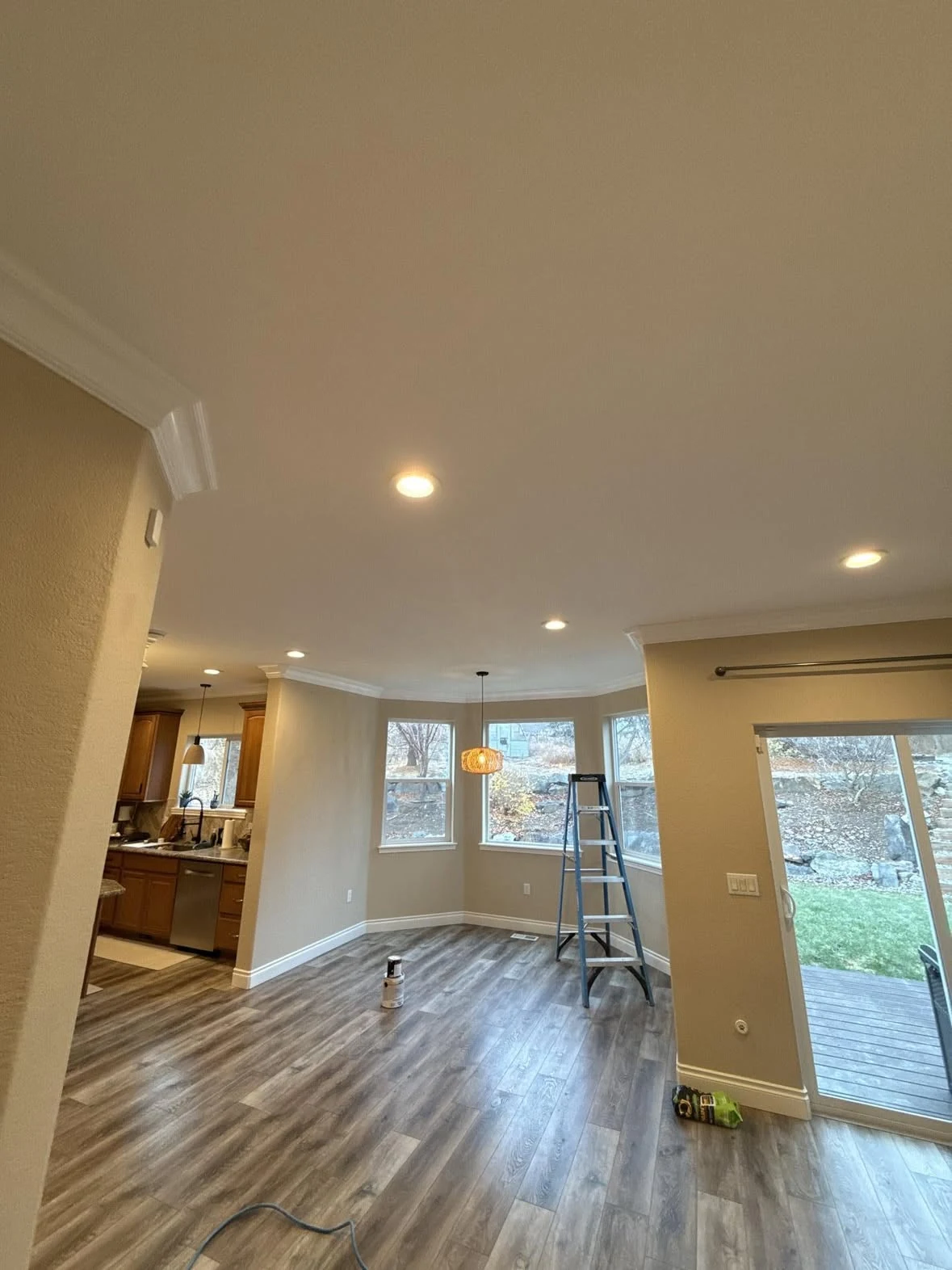 Finished open-plan renovation with hardwood flooring and recessed lighting